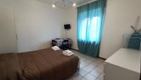 A bed or beds in a room at Pitagora