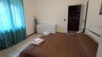 A bed or beds in a room at Pitagora