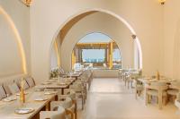 a dining room with tables and chairs and an archway at Sunrise Anjum Resort in Marsa Alam City