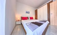 Posteľ alebo postele v izbe v ubytovaní Apartments CVITA Holiday