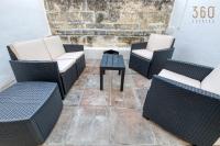 a group of chairs and a table on a patio at Authentic &amp; Spacious 3BR home with Private Terrace by 360 Estates in Rabat