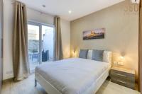a bedroom with a large bed and a window at Authentic &amp; Spacious 3BR home with Private Terrace by 360 Estates in Rabat