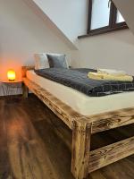 Postel nebo postele na pokoji v ubytování Apartmán KUGA