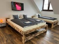 Postel nebo postele na pokoji v ubytování Apartmán KUGA