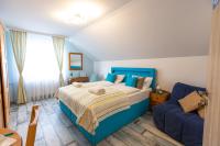 A bed or beds in a room at Balaton Fantasy Villa