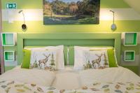A bed or beds in a room at Balaton Fantasy Villa