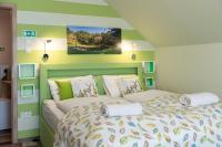 A bed or beds in a room at Balaton Fantasy Villa