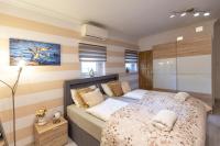 A bed or beds in a room at Balaton Fantasy Villa