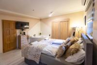 A bed or beds in a room at Balaton Fantasy Villa