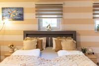 A bed or beds in a room at Balaton Fantasy Villa