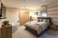 A bed or beds in a room at Balaton Fantasy Villa
