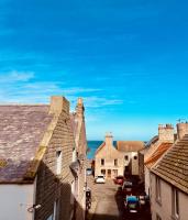 an aerial view of a town with houses and the ocean at The Crows Nest in Eyemouth
