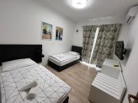 Posteľ alebo postele v izbe v ubytovaní Apartments Puntamika