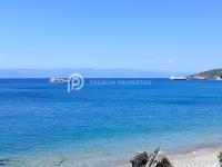 a view of the ocean with boats in the water at Villa Tranquility - Walk to the Beach with Infinity Pool in Porto Heli