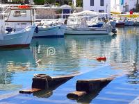 a group of boats docked in a harbor at Villa Tranquility - Walk to the Beach with Infinity Pool in Porto Heli
