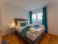 Łóżko lub łóżka w pokoju w obiekcie Ferienwohnung Emilia