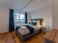 Łóżko lub łóżka w pokoju w obiekcie Ferienwohnung Emilia