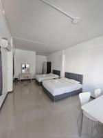 Postel nebo postele na pokoji v ubytování Loft 21 Apartment Romklao