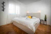 Posteľ alebo postele v izbe v ubytovaní Apartman PeTaDo