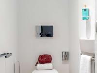 Televízia a/alebo spoločenská miestnosť v ubytovaní Novotel Suites Malaga Centro
