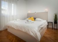 Posteľ alebo postele v izbe v ubytovaní Apartman PeTaDo