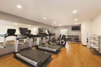 a gym with several treadmills and cardio machines at Hyatt Place Atlanta Airport North in Atlanta