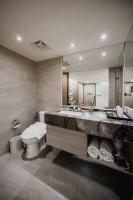 a bathroom with a sink and a toilet and a tub at Hub Hotel Kaohsiung Yawan Branch in Kaohsiung