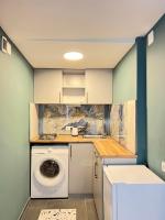 a laundry room with a washing machine in it at medea in Tbilisi City