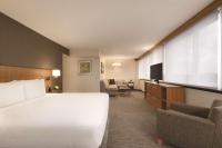 a hotel room with a bed and a television at Hyatt Place Chicago O'Hare Airport in Rosemont