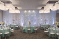 a conference room with tables and chairs and chandeliers at Hyatt Place Chicago O'Hare Airport in Rosemont