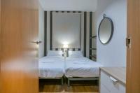 Postel nebo postele na pokoji v ubytování Modern and bright apartment in Eixample 2-2