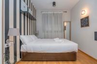 Postel nebo postele na pokoji v ubytování Modern and bright apartment in Eixample 2-2