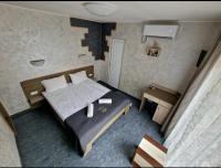 A bed or beds in a room at Guest House Simon Green