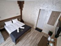 A bed or beds in a room at Guest House Simon Green