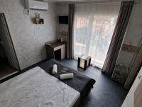 A bed or beds in a room at Guest House Simon Green