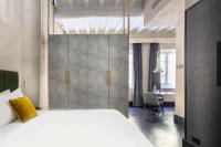 A bed or beds in a room at Numa Florence Palazzo Moro