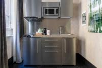 A kitchen or kitchenette at Numa Florence Palazzo Moro