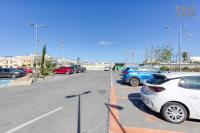 a parking lot with several cars parked in it at Bright &amp; cosy 3BR home with private balcony &amp; WIFI by 360 Estates in Dingli