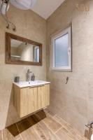 a bathroom with a sink and a mirror at Bright &amp; cosy 3BR home with private balcony &amp; WIFI by 360 Estates in Dingli