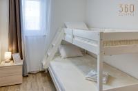a white bunk bed in a room with a window at Bright &amp; cosy 3BR home with private balcony &amp; WIFI by 360 Estates in Dingli