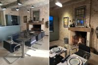 een eetkamer met een tafel en een open haard bij Le Clos 1855 in Saint-Laurent-des-Bâtons