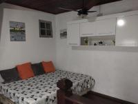 a bedroom with a bed and white cabinets at Casa com Piscina Paraty in Paraty
