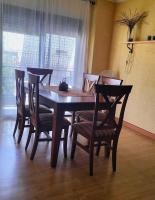 a dining room table with four chairs and a table and chairsktop at Casa Las Lomas in Prado del Rey