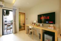 TV a/nebo společenská místnost v ubytování LA PINO HOTEL