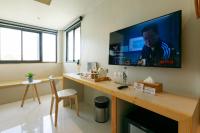 TV a/nebo společenská místnost v ubytování LA PINO HOTEL