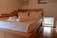 A bed or beds in a room at Dolichi House