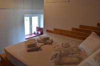 A bed or beds in a room at Dolichi House