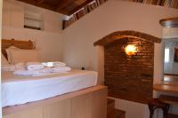 A bed or beds in a room at Dolichi House