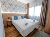 Posteľ alebo postele v izbe v ubytovaní Sweet Lloret Suites