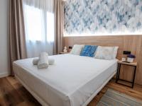 Posteľ alebo postele v izbe v ubytovaní Sweet Lloret Suites